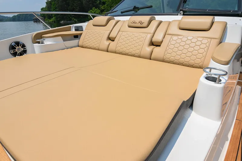 Slide: The Image of Luxurious seating on 2020 Sea Ray Sundancer 320 Coupe yacht, featuring tan upholstery. - 41