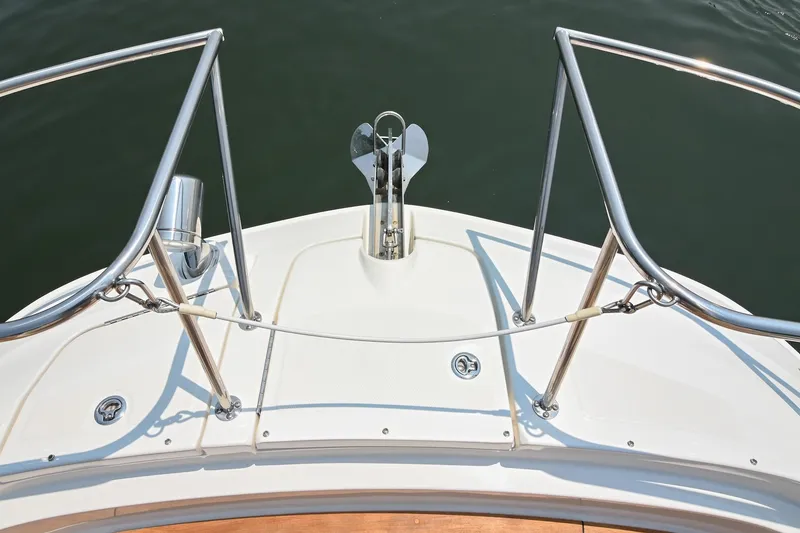 Slide: The Image of Bow of 2020 Sea Ray Sundancer 320 Coupe with anchor and railings. - 44
