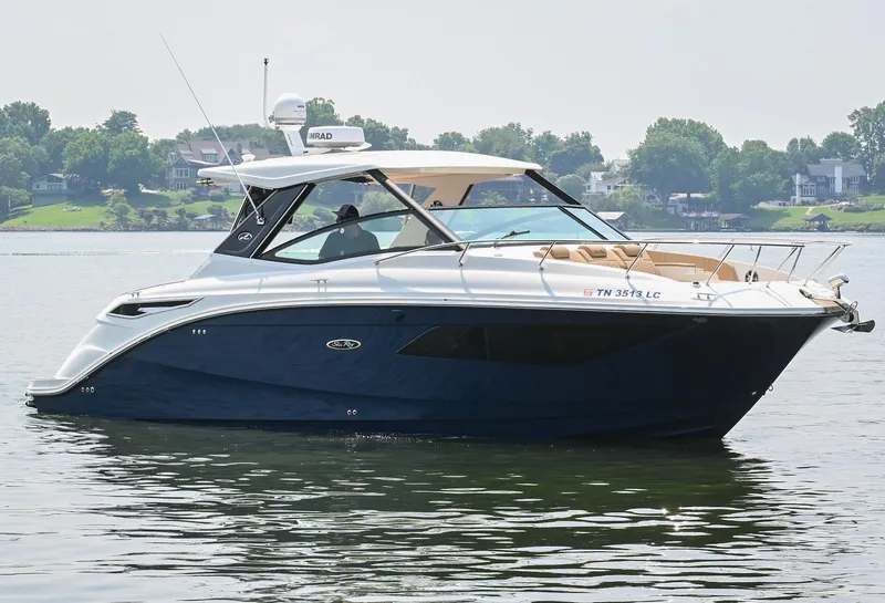 Slide: The Image of 2020 Sea Ray Sundancer 320 Coupe cruising on a calm lake. - 7