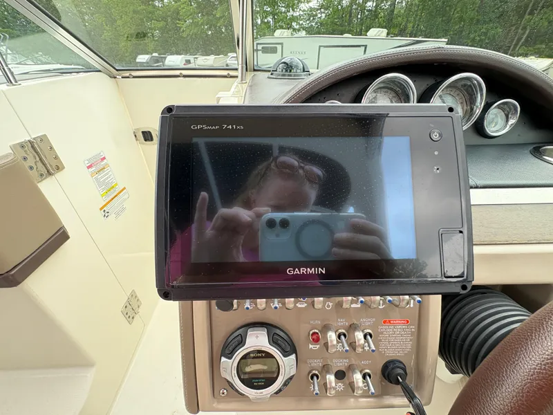 Slide: The Image of Garmin GPS on 2011 Sea Ray 270 SLX boat dashboard with control panel. - 23
