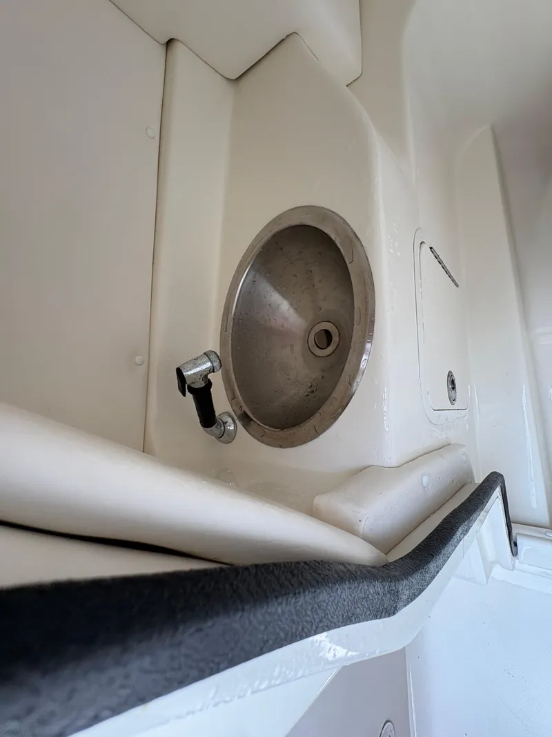 Slide: The Image of 2011 Sea Ray 270 SLX boat interior with stainless steel sink. - 29