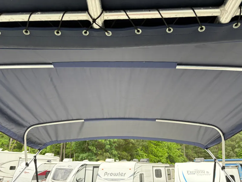 Slide: The Image of Bimini top of 2011 Sea Ray 270 SLX boat with RVs in background. - 34