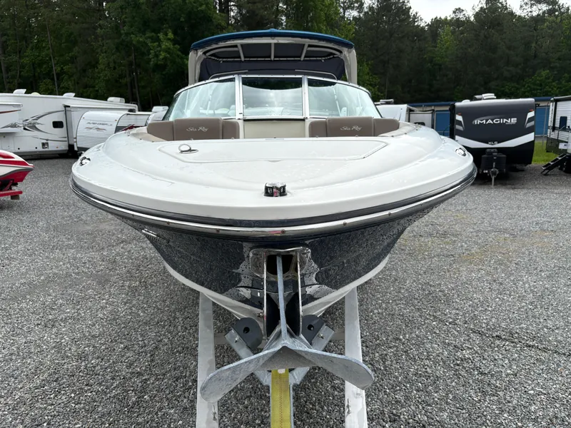 Slide: The Image of 2011 Sea Ray 270 SLX boat on display in a parking area with RVs. - 7