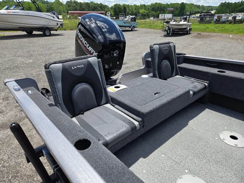 Slide: The Image of 2022 Lund 1775 Adventure SS boat interior with Mercury engine, featuring two seats and spacious deck. - 15