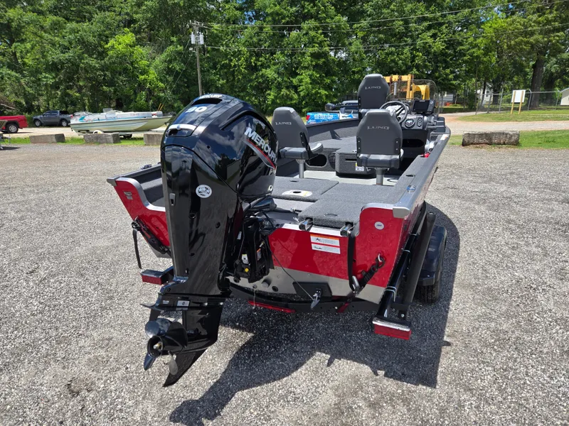 Slide: The Image of 2022 Lund 1775 Adventure SS boat with Mercury outboard motor, parked outdoors. - 4