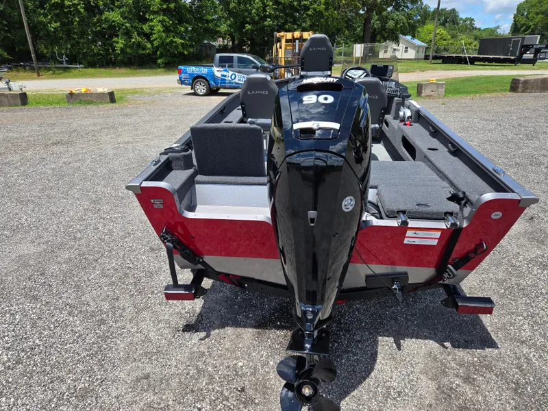 Slide: The Image of 2022 Lund 1775 Adventure SS boat with 90 HP engine, parked on gravel lot. - 5