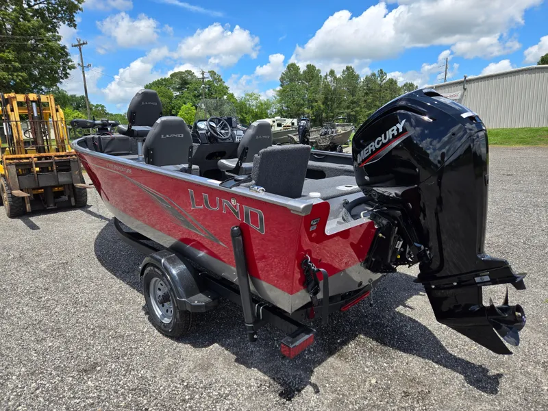 Slide: The Image of 2022 Lund 1775 Adventure SS boat with Mercury engine, parked outdoors on a sunny day. - 6