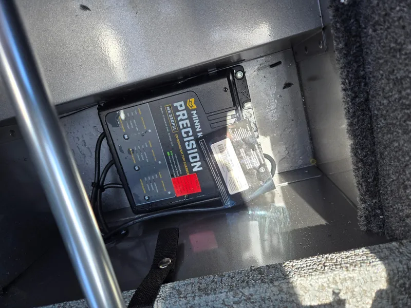 Slide: The Image of Minn Kota Precision charger inside 2022 Lund 1775 Adventure SS boat compartment. - 9