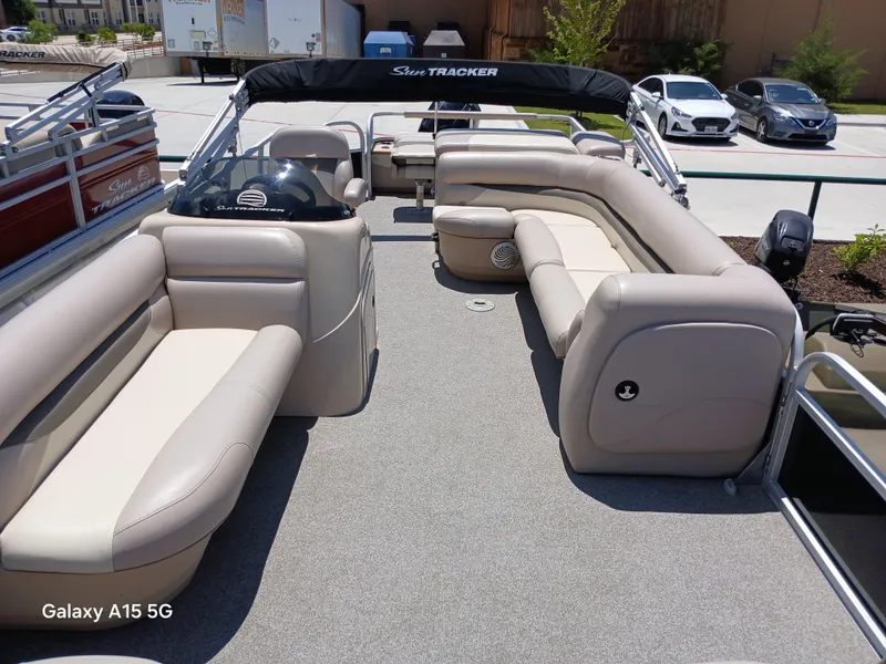 Slide: The Image of 2015 Sun Tracker Fishin Barge 24 DLX with spacious seating and modern design. - 12