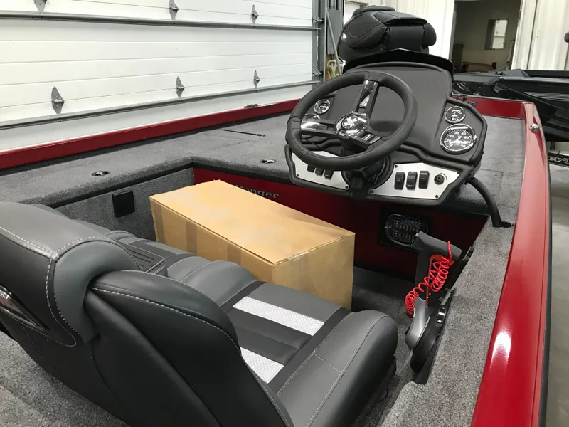Slide: The Image of 2025 Ranger RT178C boat interior with steering wheel and seating. - 6