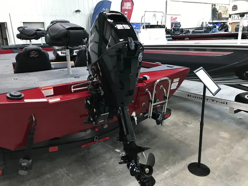 Slide: The Image of 2025 Ranger RT178C boat with powerful outboard motor in showroom display. - 8
