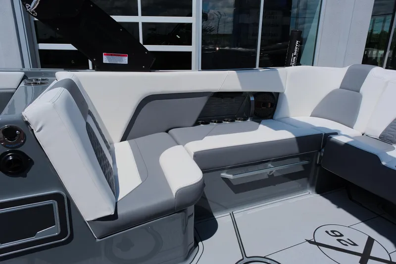 Slide: The Image of 2025 MasterCraft X26 boat interior with sleek gray and white seating design. - 15