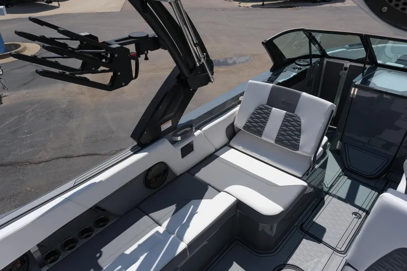 Slide: The Image of 2025 MasterCraft X26 boat interior with sleek seating and modern design. - 16
