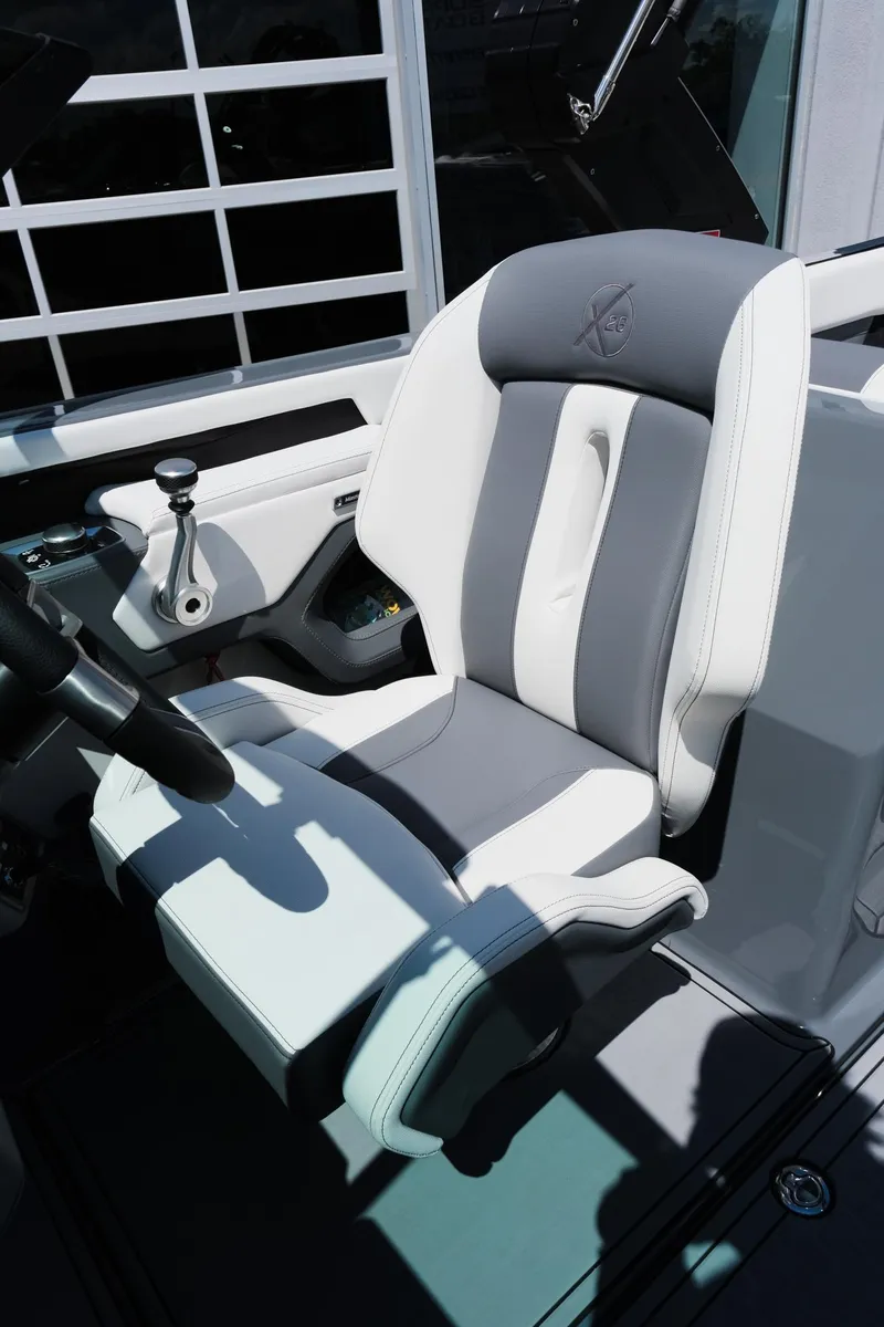 Slide: The Image of 2025 MasterCraft X26 boat seat, featuring sleek gray and white design with ergonomic comfort. - 18