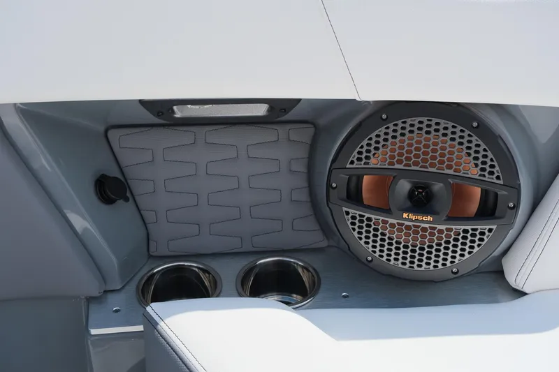 Slide: The Image of 2025 MasterCraft X26 boat interior with Klipsch speaker and cup holders. - 28