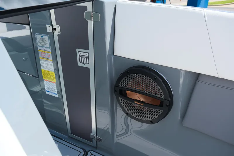 Slide: The Image of 2025 MasterCraft X26 boat interior with speaker and storage compartment. - 29