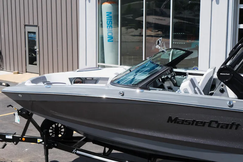 Slide: The Image of 2025 MasterCraft X26 boat displayed outdoors, showcasing sleek design and modern features. - 46