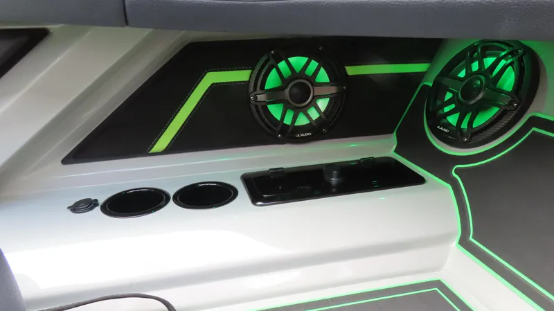 Slide: The Image of 2025 Outerlimits 46 SC interior with green LED lighting and speakers. - 17