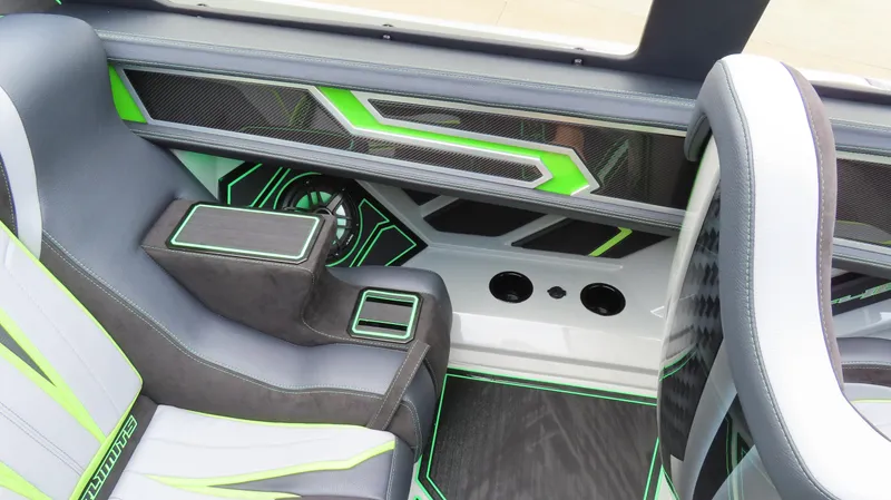 Slide: The Image of Interior of 2025 Outerlimits 46 SC boat with modern design and green accents. - 22