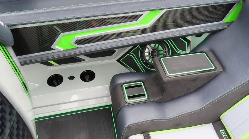 Slide: The Image of 2025 Outerlimits 46 SC interior with sleek black and green design accents. - 23