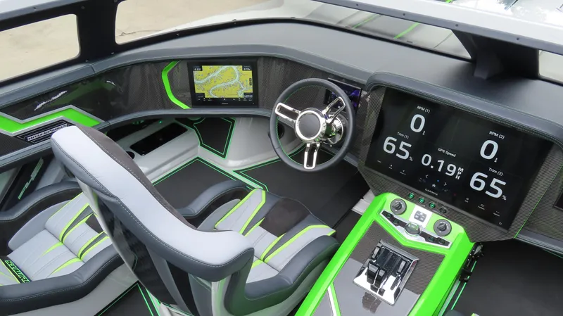 Slide: The Image of 2025 Outerlimits 46 SC cockpit with modern dashboard, digital displays, and sleek green accents. - 27