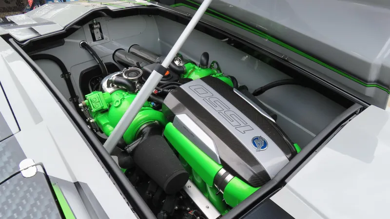 Slide: The Image of 2025 Outerlimits 46 SC engine compartment with vibrant green components and sleek design. - 30