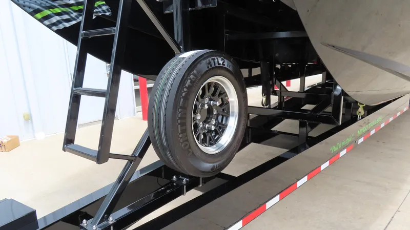 Slide: The Image of 2025 Outerlimits 46 SC boat trailer with ladder and spare tire. - 5