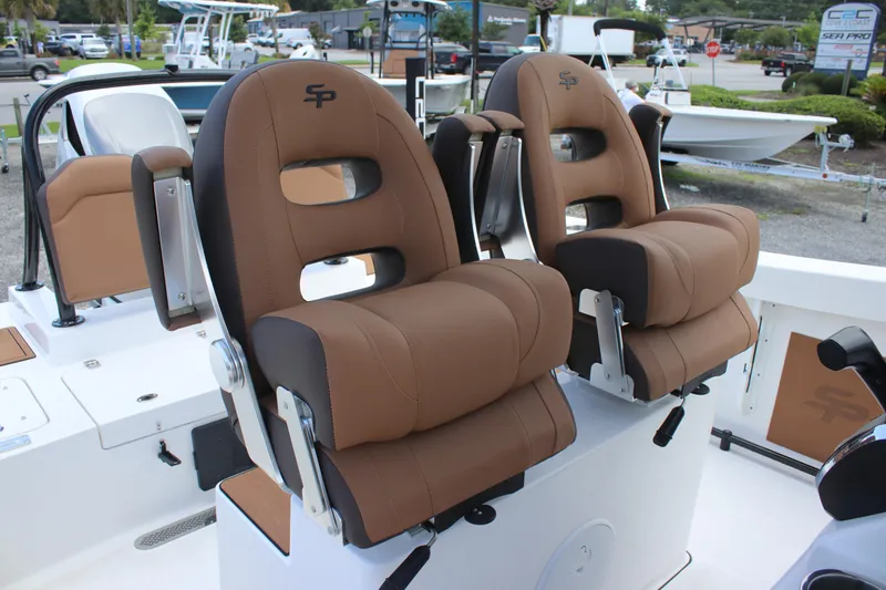 Slide: The Image of 2025 Sea Pro 245 FLX boat seats, brown upholstery, modern design, outdoor setting. - 11