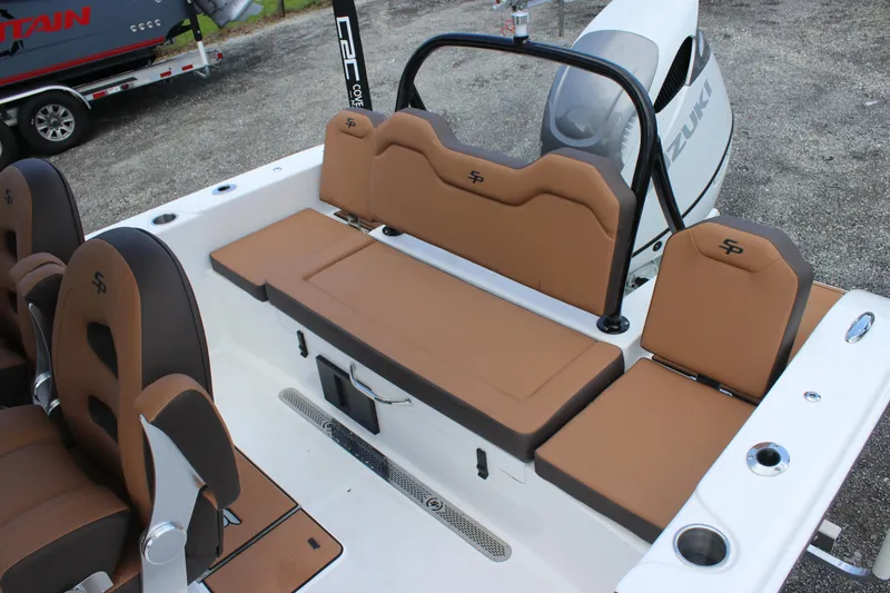 Slide: The Image of 2025 Sea Pro 245 FLX boat interior with tan seating and modern design. - 13