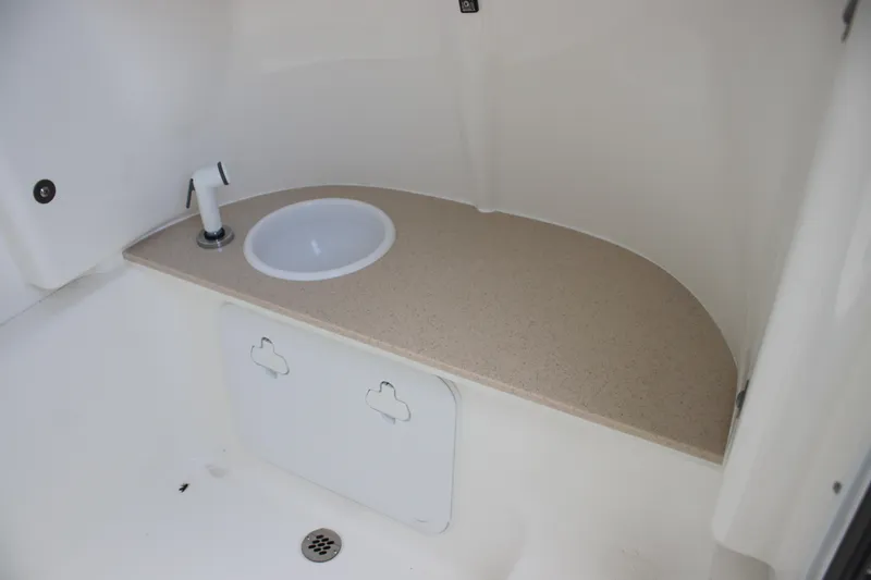 Slide: The Image of 2025 Sea Pro 245 FLX boat interior with sink and countertop. - 21