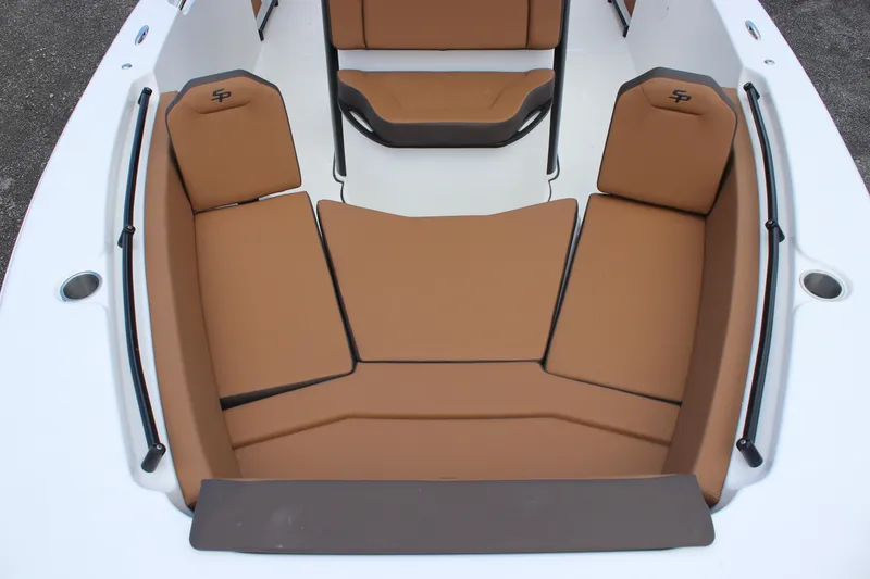 Slide: The Image of 2025 Sea Pro 245 FLX boat interior with brown cushioned seating. - 23