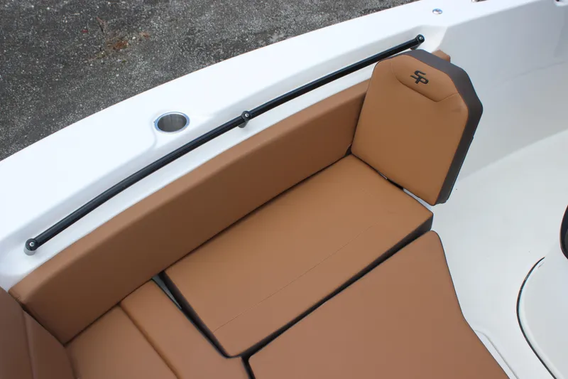 Slide: The Image of 2025 Sea Pro 245 FLX boat with tan seating and sleek design. - 24