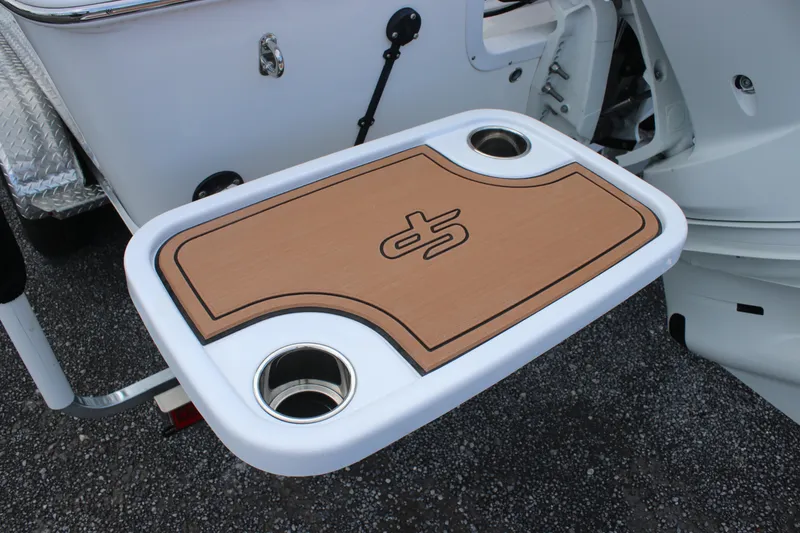 Slide: The Image of 2025 Sea Pro 245 FLX boat table with cup holders, featuring a stylish wood finish. - 30