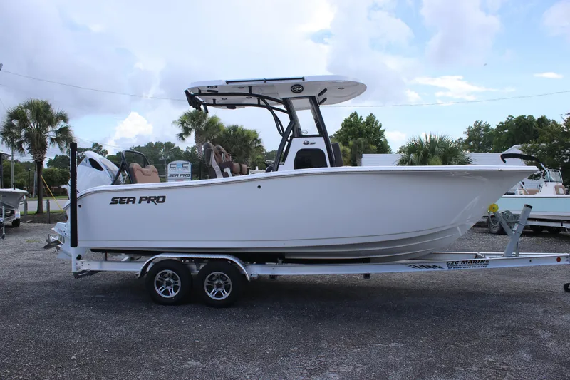 Slide: The Image of 2025 Sea Pro 245 FLX boat on trailer, side view, outdoors. - 6