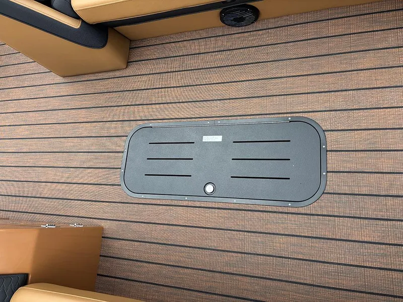 Slide: The Image of 2025 Bentley Pontoons Elite 253 Swingback Tritoon deck with storage hatch. - 19