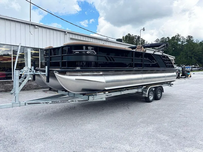 Slide: The Image of 2025 Bentley Pontoons Elite 253 Swingback Tritoon on trailer, parked outdoors. - 2