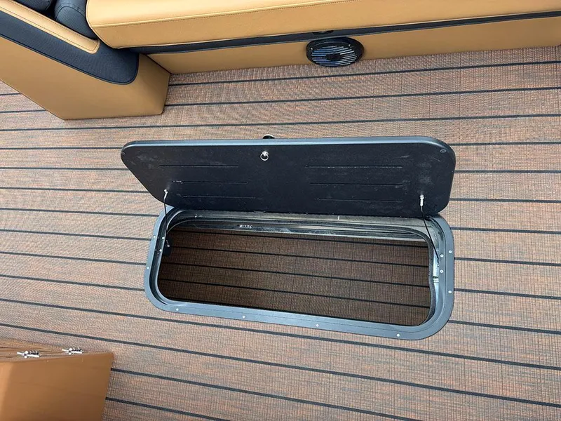 Slide: The Image of Open storage compartment on 2025 Bentley Pontoons Elite 253 Swingback Tritoon deck. - 20