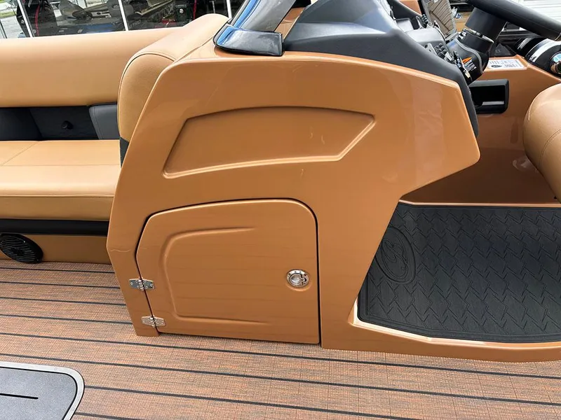 Slide: The Image of 2025 Bentley Pontoons Elite 253 interior, featuring tan console and seating on a tritoon boat. - 21