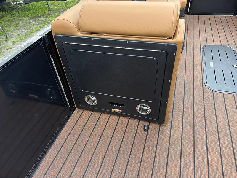 Slide: The Image of 2025 Bentley Pontoons Elite 253 interior with tan seating and wood-patterned flooring. - 24