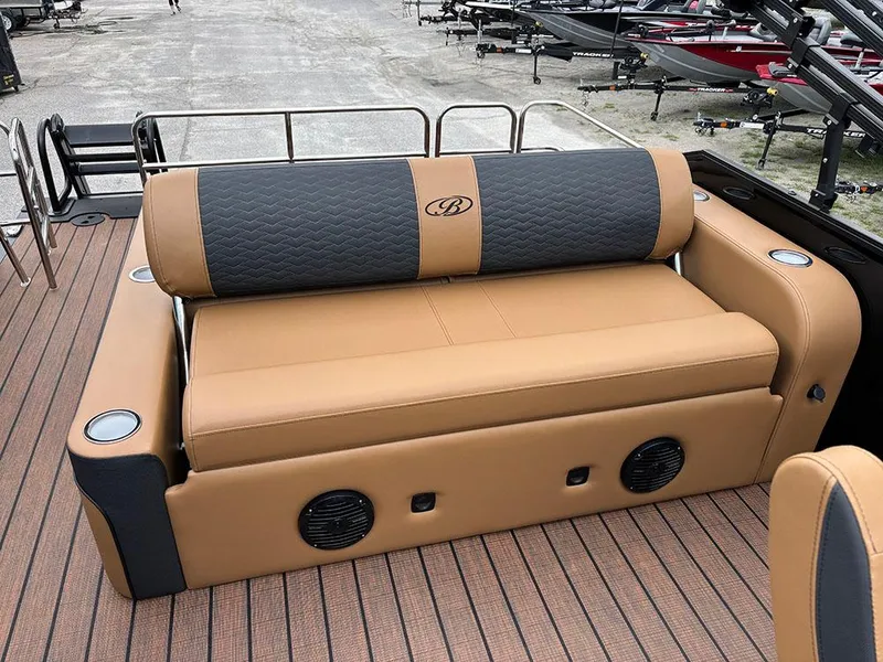 Slide: The Image of 2025 Bentley Pontoons Elite 253 Swingback Tritoon, luxurious tan seating, dual captain design. - 26
