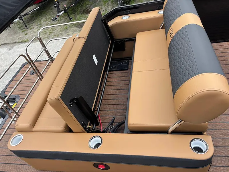Slide: The Image of 2025 Bentley Pontoons Elite 253 Swingback interior with tan and gray seating, cup holders. - 29