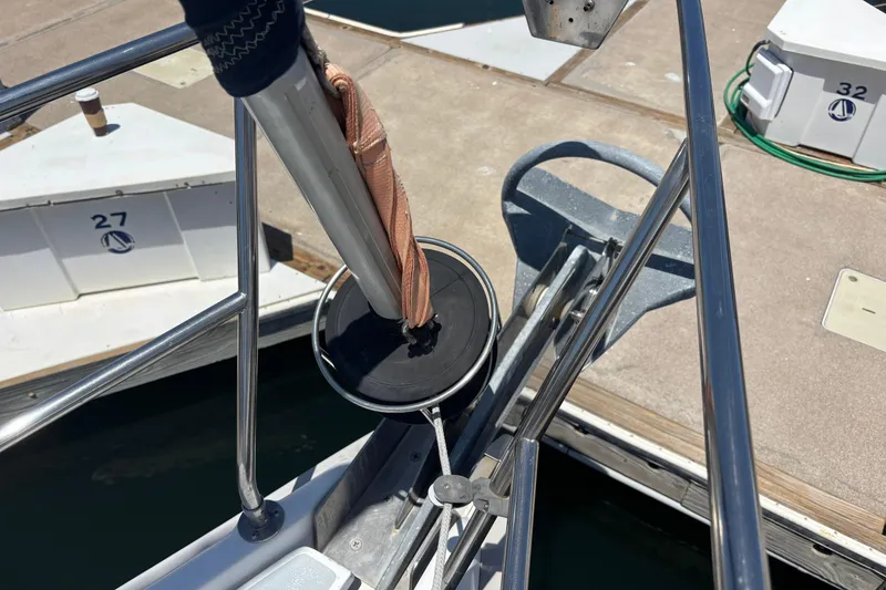 Slide: The Image of Bow of 1999 Hunter 410 sailboat with anchor and dock view. - 12