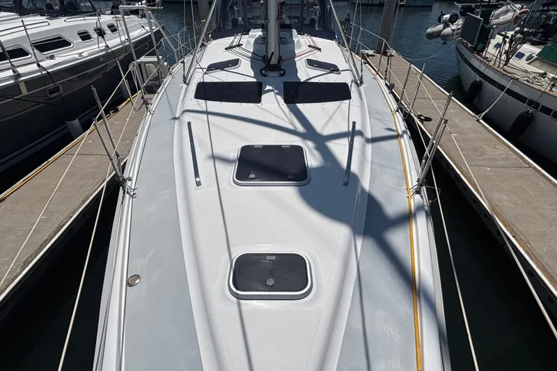 Slide: The Image of 1999 Hunter 410 sailboat docked at marina, top deck view. - 14
