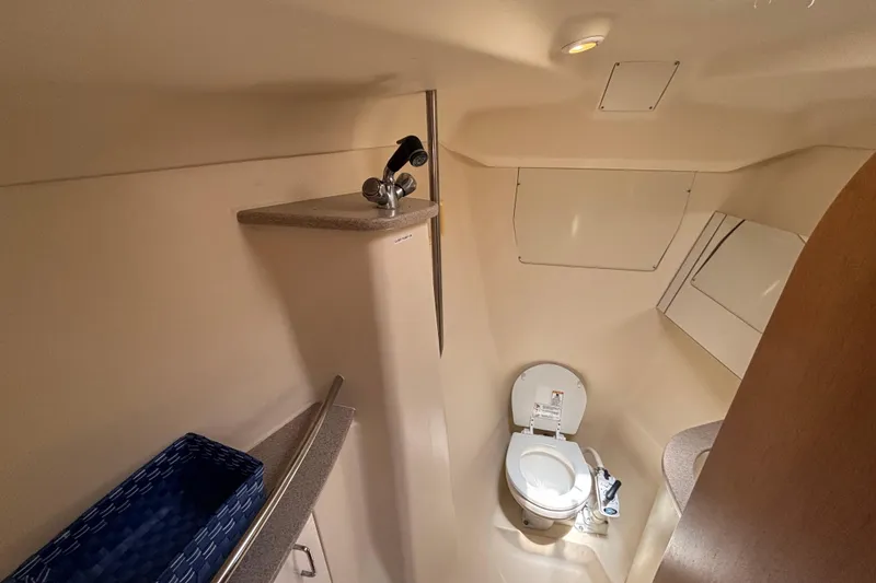 Slide: The Image of Compact bathroom in a 1999 Hunter 410 yacht, featuring a toilet and sink. - 50