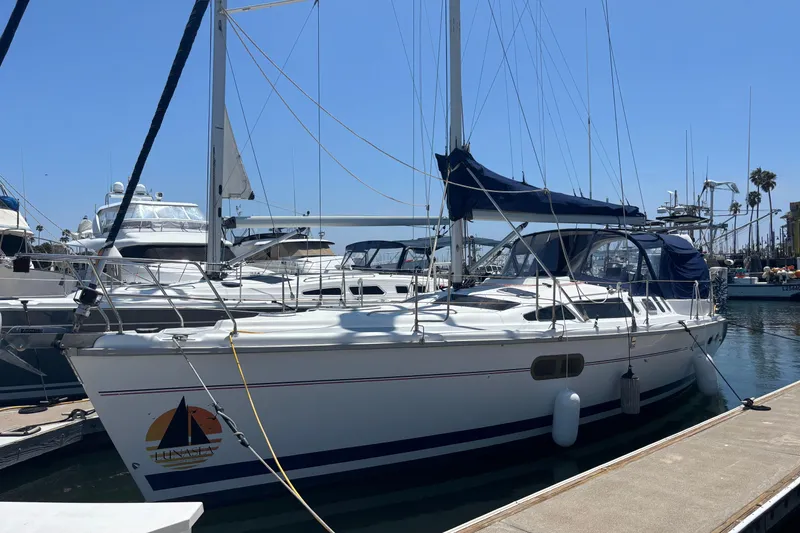 The Image of Sailboat docked at marina, 1999 Hunter 410 model, clear blue sky background. - 6