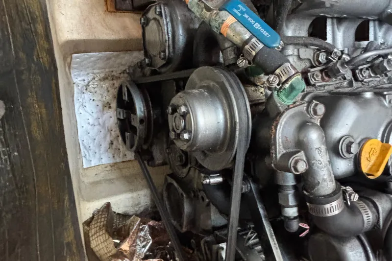 Slide: The Image of 1999 Hunter 410 engine close-up with belts and hoses visible. - 64