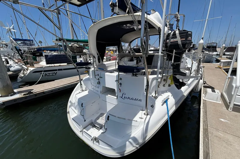 Slide: The Image of Hunter 410 sailboat from 1999 docked at a marina, rear view. - 71