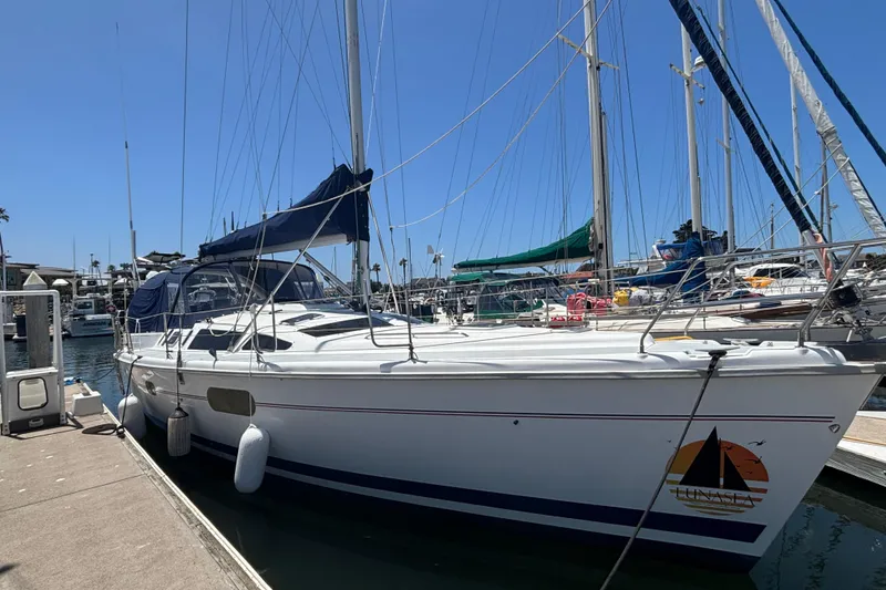 Slide: The Image of Sailboat docked at marina, 1999 Hunter 410 model, clear blue sky. - 8