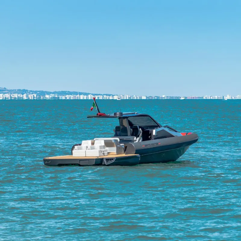 Slide: The Image of 2025 Anvera 42 boat on calm blue sea with distant city skyline. - 4