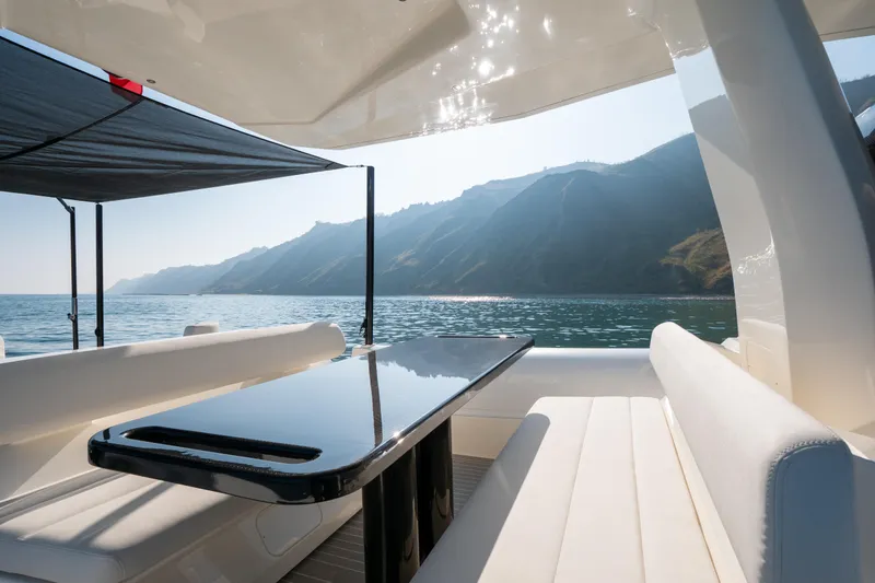 Slide: The Image of Luxurious 2025 Anvera 42 yacht interior with ocean view and sleek seating. - 6